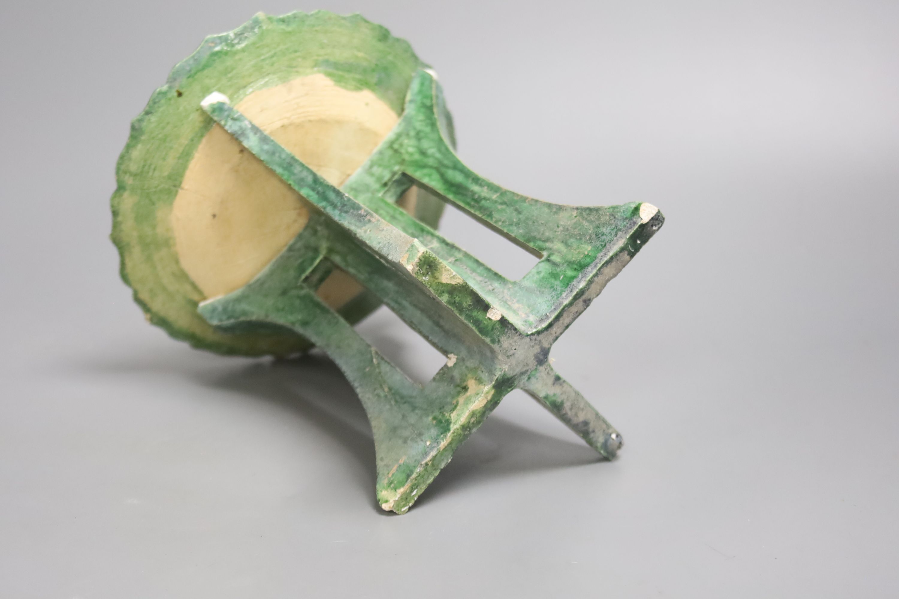 A Chinese Ming offering dish, on pottery stand
